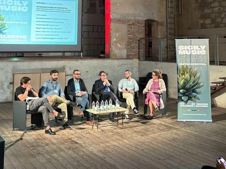 A group of people sitting in chairs
